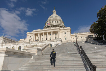 Capital hill of America and police officer - 779106673