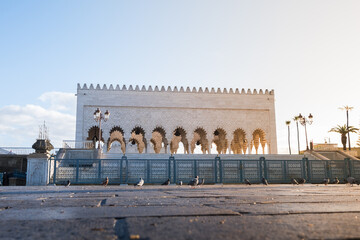 Sunrise at the Mausoleum of Mohammed V. It's a royal tomb located in Rabat, the capital of Morocco. The mausoleum houses the tomb of King Mohammed V, and his sons Hassan II and Mulay Abdella - obrazy, fototapety, plakaty
