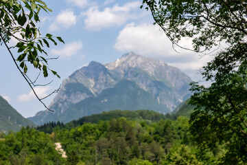 Scenic view of mount Vrh Krnice seen from Bovec, Triglav National Park, Julian Alps, Slovenia. Jagged contours of majestic mountain peaks in Soca valley. Wanderlust hiking in untamed Slovenian Alps