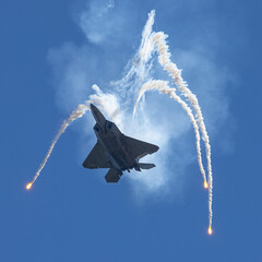 Bottom view of a F-22 Raptor deploying flares