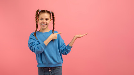Girl presenting with hand gesture and smile