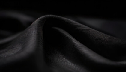 Elegant dark fabric, gracefully folded, highlighting texture and quality.
