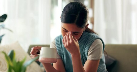 Living room, coffee and student with headache for stress, exhausted or anxiety for exam at home. Woman, migraine and tired with mug on sofa for mental health, university burnout or overworked