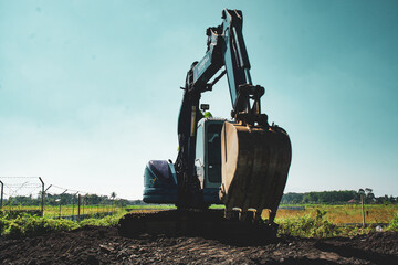 Excavator working in the field