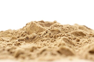 A pile of sand on a white surface. Perfect for backgrounds