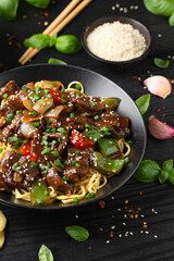 Stir fried beef in black bean sauce with vegetables and noodles. Take away food