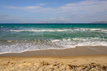Fototapeta na wymiar Marmari beach on the island of Kos. Beautiful sandy beach with turquoise waters. Greece