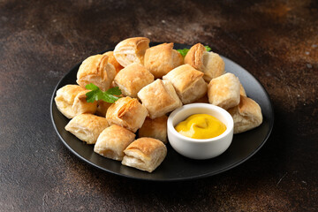 Cheese and onion puff pastry rolls. Vegetarian food, snack