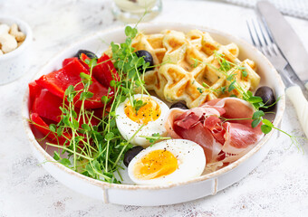 English breakfast. Boiled egg, jamon, waffles and green herbs. - 779142264