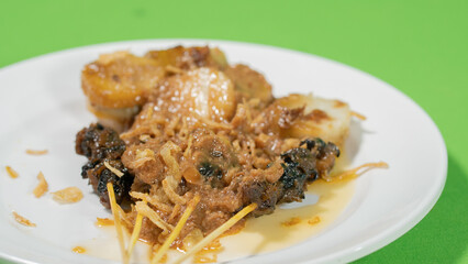 Satay served with peanut sauce and compressed rice cake