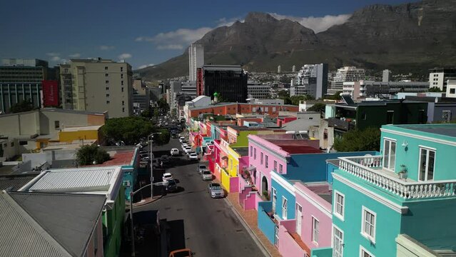 View of the colorful Bo-Kaap in Cape Town, South Africa. A popular daytime destination, hillside Bo-Kaap is known for its narrow cobbled streets lined with colorful houses