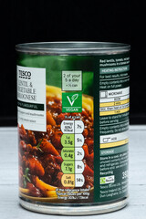 Tesco branded Lentil and vegetable bolognese in a tin can that is recyclable displaying graphics...