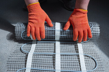 Instalation of electric underfloor heating mats. Electric floor heating.

