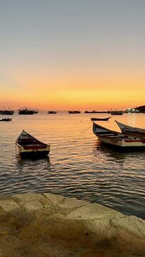 Fishing boats during a beautiful sunset in Juan Griego beach, Margarita Island. Venezuela