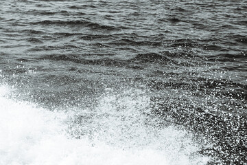 Black and white abstract background top view surface ocean wave splash creating white air foam...