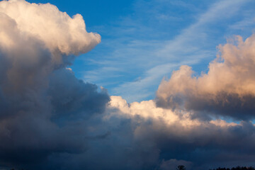Naklejka na ściany i meble Storm Clouds forming at sunset.