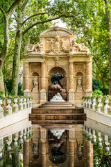 Fontaine Médicis, monumental fountain commissioned by Marie de' Medici by inside Jardin du Luxembourg in the 6th Arrondissement of Paris, France - obrazy, fototapety, plakaty