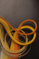 Yellow, orange, black color strip gradient wave curve paper. Abstract texture background.
