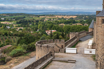 
Architecture of the citadel of the town of Carcassonne with the surrounding nature and town in the south of France - 779179070