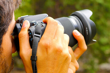 Close view of a photographer taking a photograph