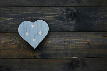wooden heart with national flag of Federated States of Micronesia on the wooden background. - obrazy, fototapety, plakaty
