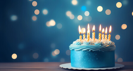 a blue birthday cake with candles