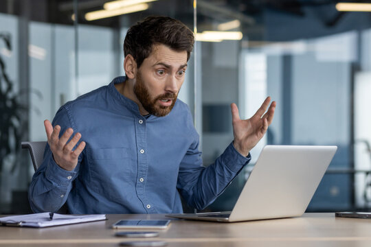 Surprised office worker reacting to computer screen - Powered by Adobe