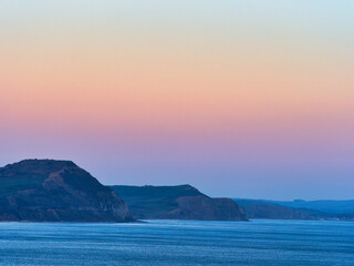 The moods of the jurassic coastline with Lyme Bay captured on January evenings from Lyme Regis in Dorset