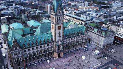 Amazing drone view  on city hall of Hamburg with tourists/ fountain . old statues