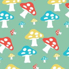 Pattern of multi-colored fly agarics on a green background, flat ornament