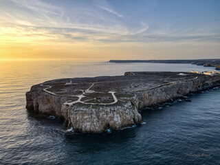 Cape Sagres, Portugal, at sunset with Sao Vincent in the background