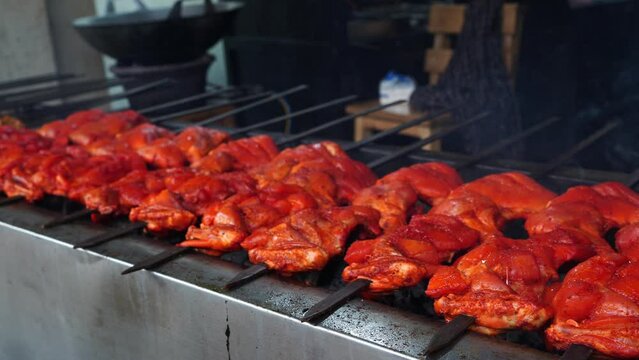 Skewers of shish kebab and chicken cooked on a grill near Ampel area in Surabaya, Indonesia. Street Food Photography.