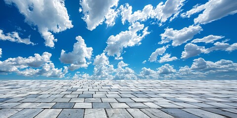 paving slabs and blue sky with clouds.  background with perspective.  place for creative text, advertising - obrazy, fototapety, plakaty