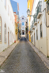 Obraz premium Street overlooking the parish church of Nossa Senhora das Merces in Lisbon-portugal