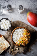 Mango Teriyaki chicken with rice in a wood bowl