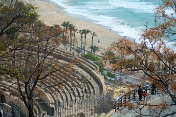 Impressive contrast between the ancient Roman amphitheater and Tarragona beach, creating a unique...