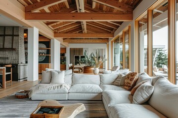 Spacious and inviting rustic interior of a lakeside home with exposed wooden beams and an abundance of natural light...