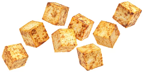Gordijnen Falling fried tofu cubes isolated on white background © xamtiw