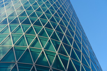 futuristic greenish mirror cylindrical Westhafen tower, 30-story skyscraper Westhafen Tower in...