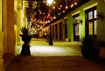 A quiet pedestrian only street at night in the New Orleans French Quarter - 779257879