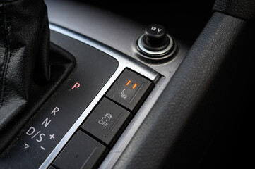 Seat heating button. Interior of car close up