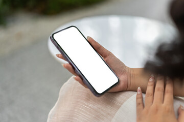 Human working on modern smartphone with blank white mobile screen for advertising, mockup, technology, advertising, search information, creative design, social media, online marketing, chat, phone.