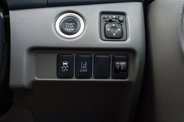 Naklejka premium A car's dashboard with a start button