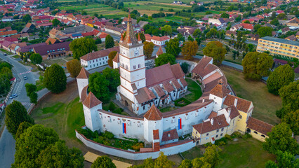 Fototapeta premium Sunset view of the Fortified Evangelical Church in Harman, Romania
