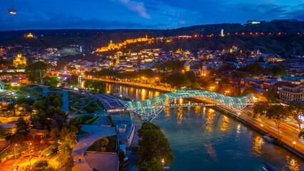 Sunset view of Narikala fortress and the Bridge of Peace in Tbilisi, Georgia