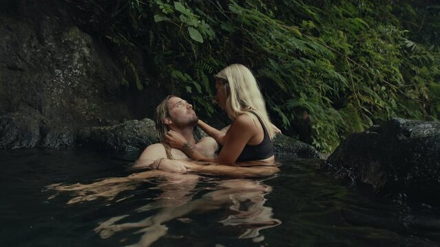 Man and Woman Relaxing in a hot spring Pool