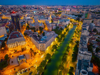 Sunset panorama view of Dambovita river passing the old town of Bucharest, Romania