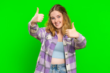 Like. Young woman raises thumbs up agrees with something or gives positive reply recommends...