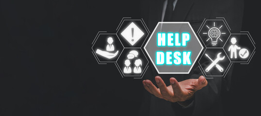 Help desk concept, Businessman hand holding help desk icon on virtual screen.