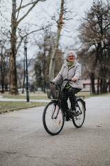 Mature female retiree cycling outdoors, active lifestyle concept with a focus on retirement activities and health.